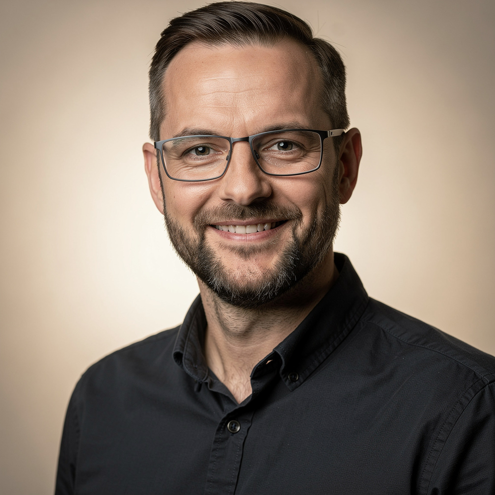 Studio portrait of a bearded man director of photography